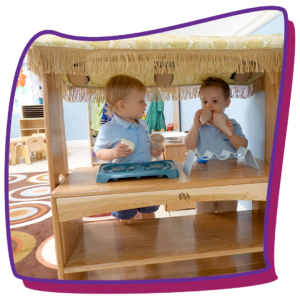 2-year-old kids playing under canopy