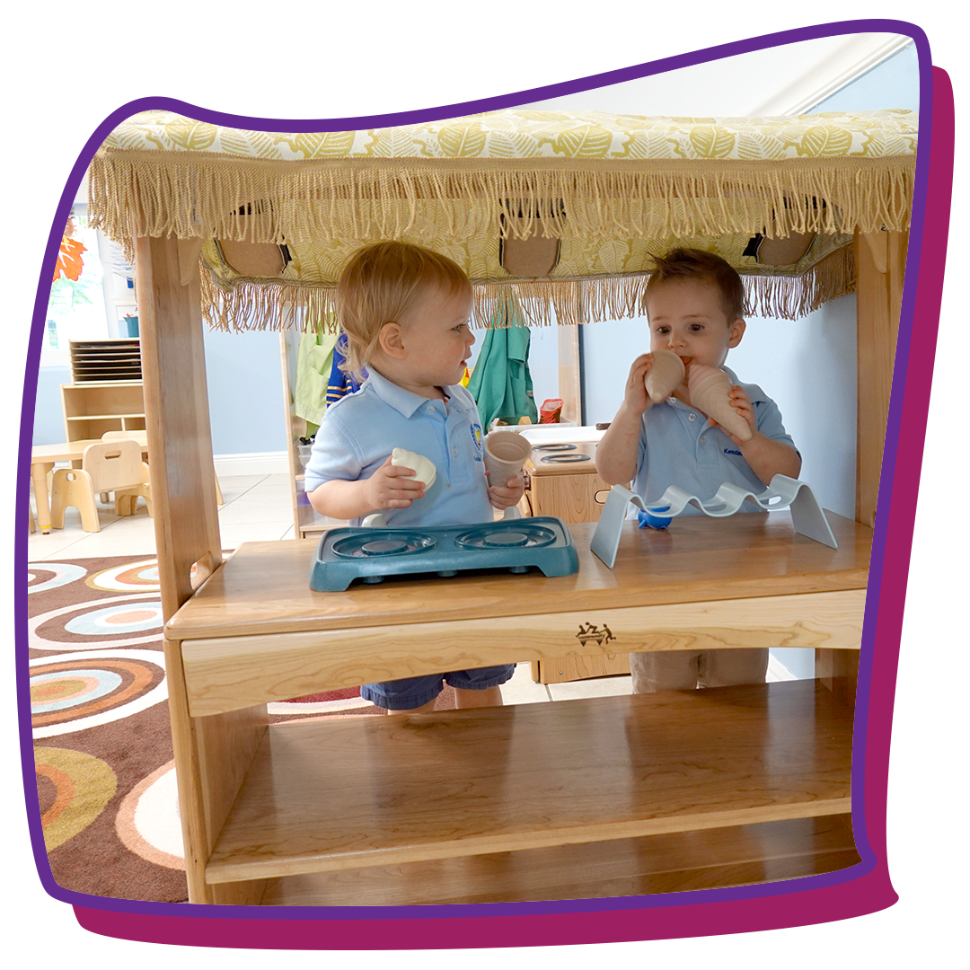 2-year-old kids playing under canopy