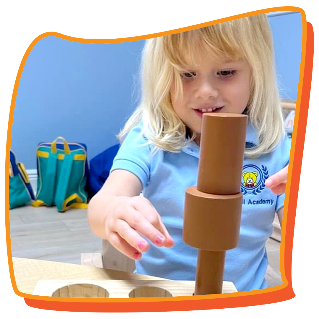 3-year-old girl playing with blocks